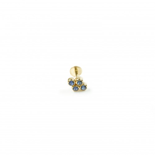 colored 18k gold ear piercing with blue stones